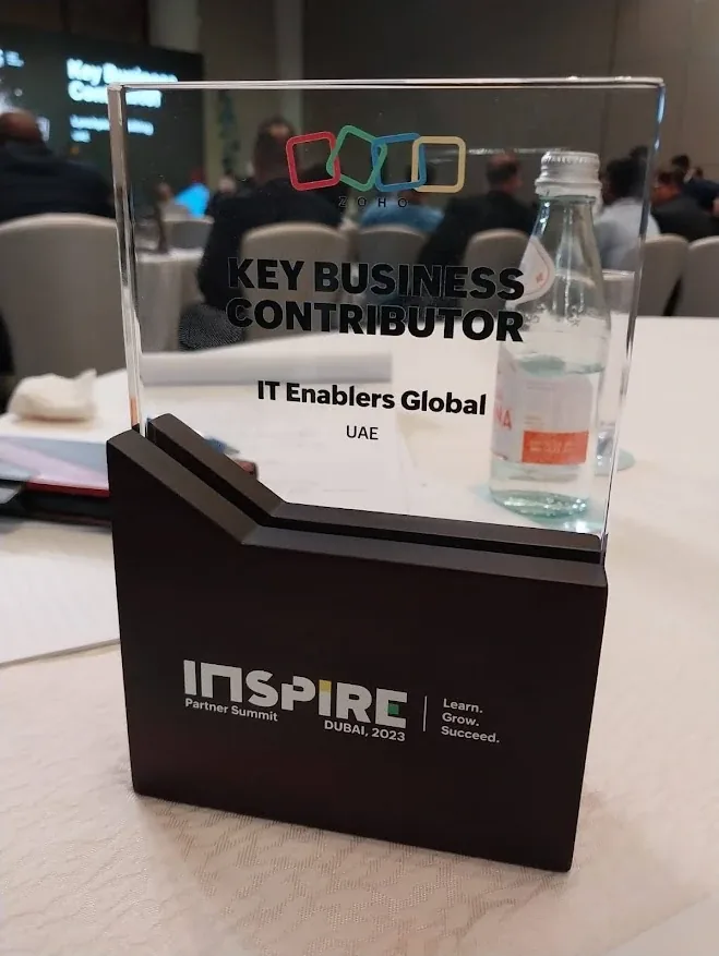 Zoho Key Business Contributor award trophy presented to IT Enablers Global (UAE) at the Inspire Partner Summit Dubai 2023